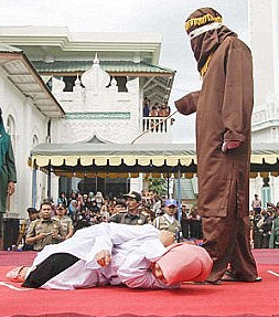 Muslim woman being beaten